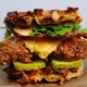 Illustration for article titled This insane fried chicken waffle burger is three burgers in one